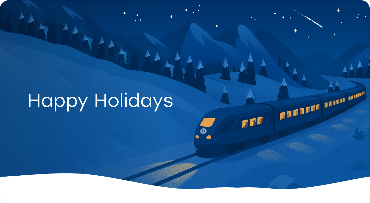 A train moving through snowy mountains with the message happy holidays